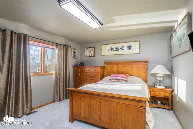 bedroom featuring light colored carpet