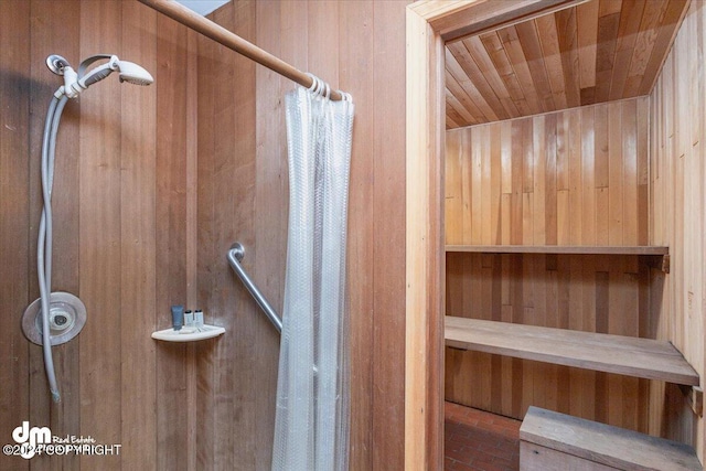 view of sauna / steam room with wood walls and wooden ceiling