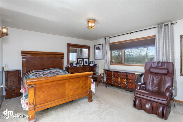 carpeted bedroom featuring a textured ceiling