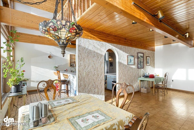 dining room featuring wooden ceiling and beam ceiling