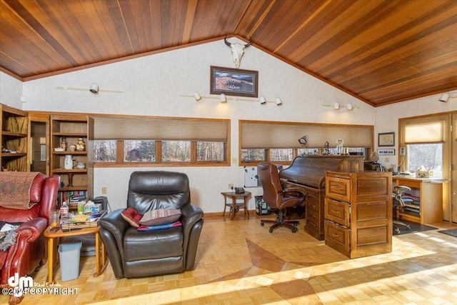 office space featuring light parquet floors, a wealth of natural light, built in desk, and wooden ceiling