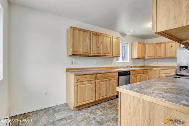 kitchen featuring appliances with stainless steel finishes, light brown cabinets, and a baseboard heating unit