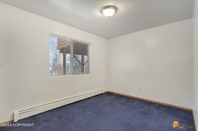 carpeted spare room with baseboard heating