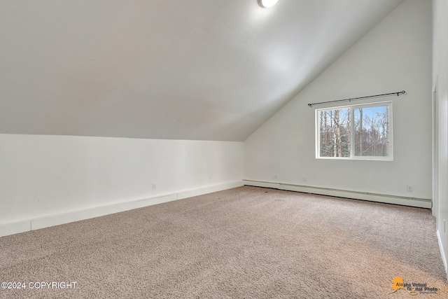 additional living space featuring carpet flooring, lofted ceiling, and a baseboard radiator