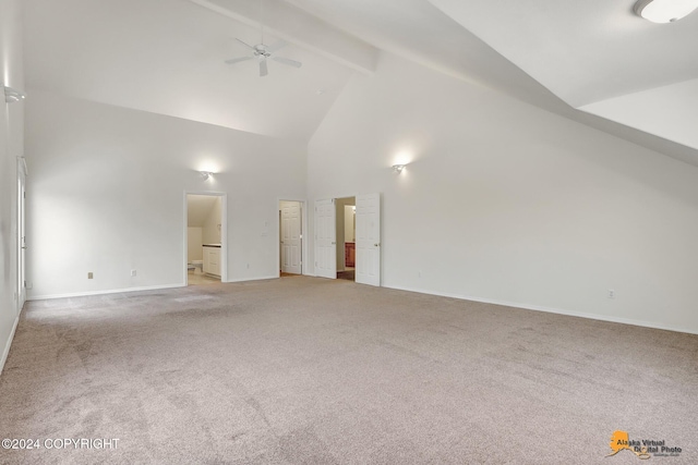 interior space featuring beam ceiling, carpet flooring, high vaulted ceiling, and ceiling fan