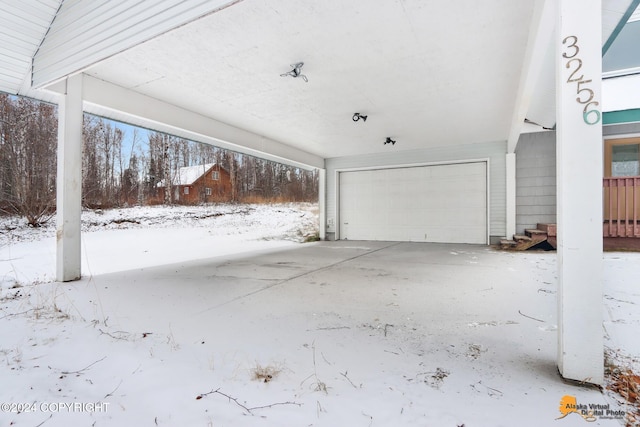 view of snow covered garage