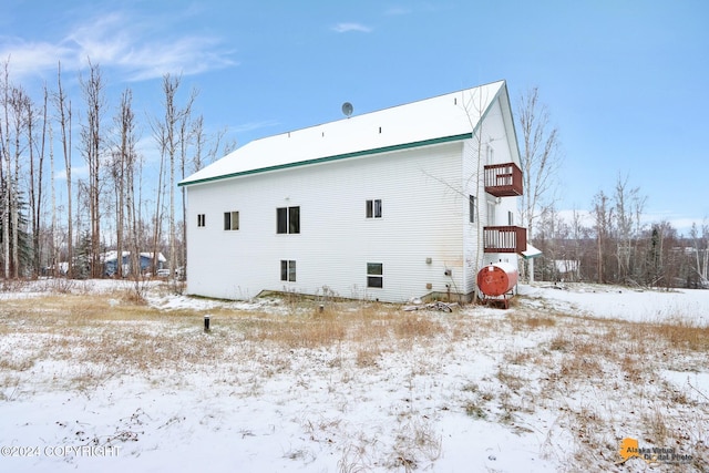 view of snow covered house