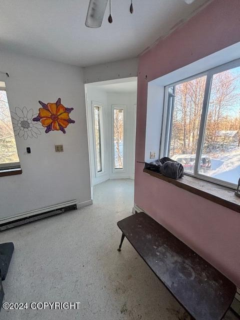 interior space featuring a baseboard heating unit