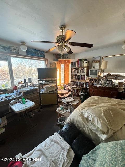 bedroom featuring wood-type flooring and ceiling fan