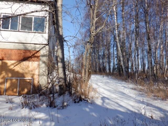 view of snow covered property