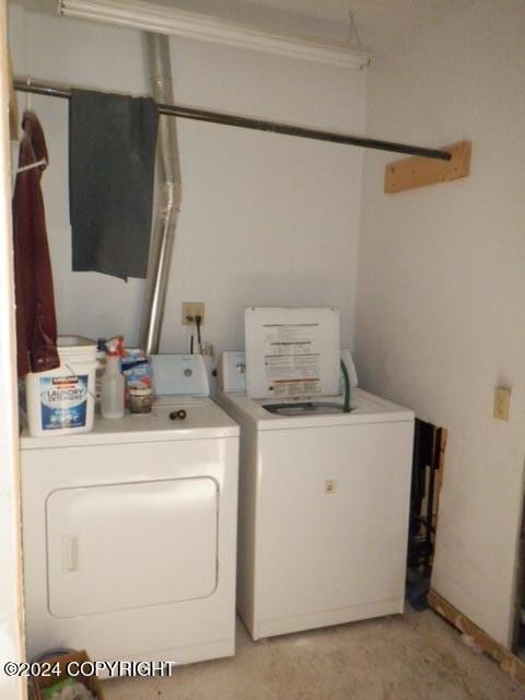 laundry area featuring washing machine and clothes dryer