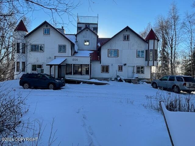 view of snow covered property