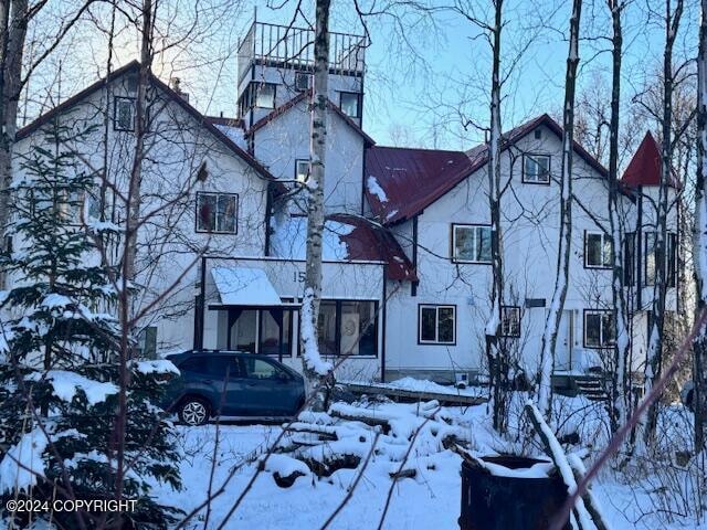 view of snow covered house