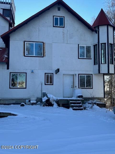 view of snow covered house