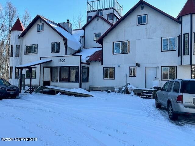 view of snow covered house