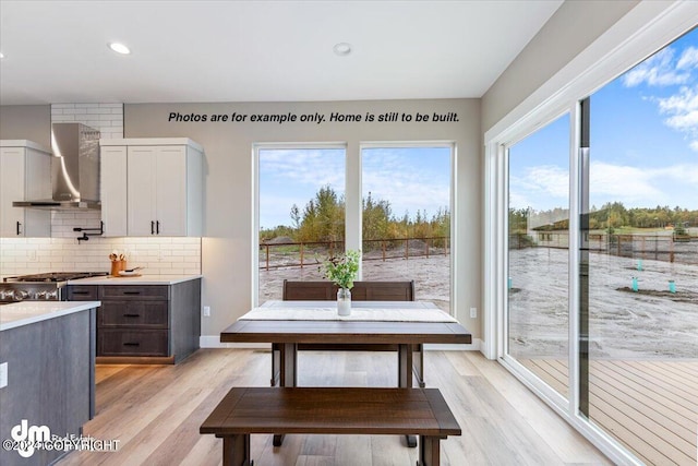 dining area with light hardwood / wood-style floors