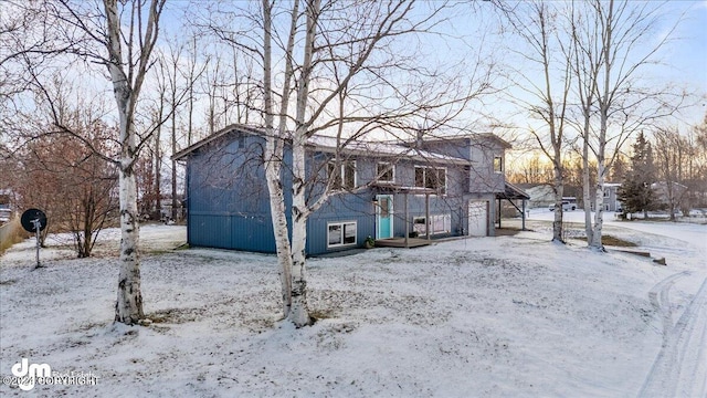 view of snow covered house