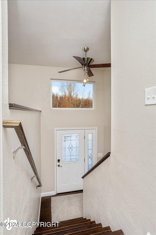 entrance foyer featuring ceiling fan