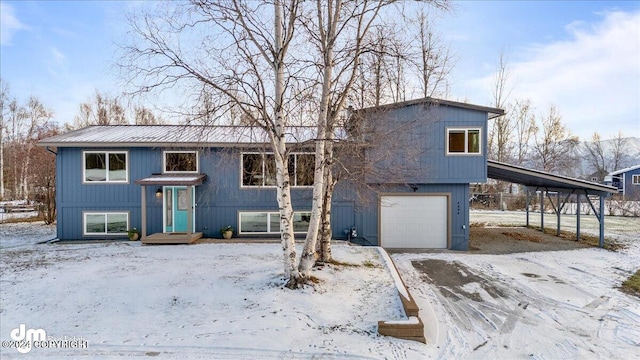 split foyer home with a garage and a carport