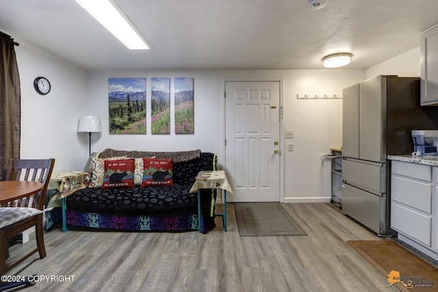 living room with light hardwood / wood-style floors