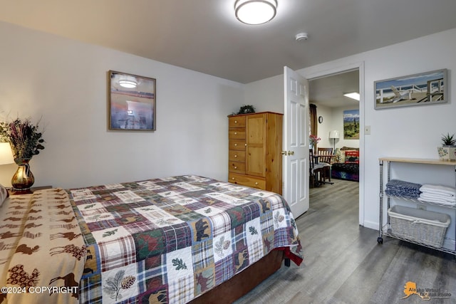 bedroom with wood-type flooring