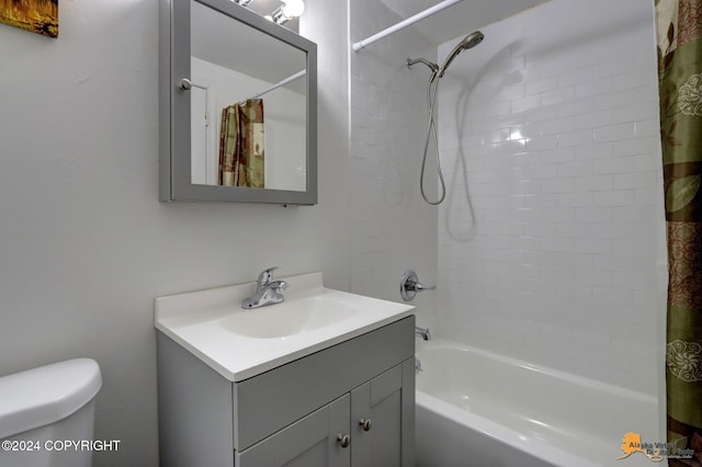 full bathroom featuring vanity, toilet, and shower / tub combo