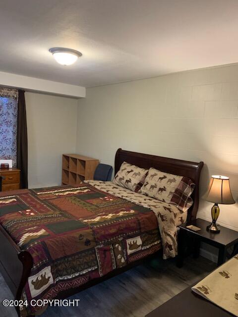 bedroom featuring dark hardwood / wood-style floors