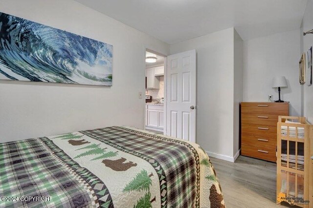 bedroom featuring wood-type flooring