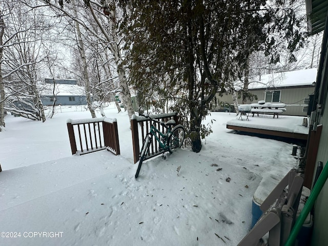 view of yard layered in snow