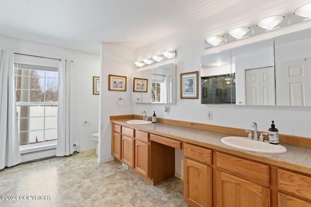 bathroom with toilet, an enclosed shower, and vanity