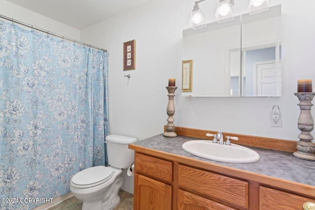 bathroom featuring walk in shower, vanity, and toilet