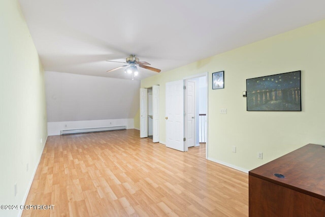 interior space featuring baseboard heating, light hardwood / wood-style floors, and ceiling fan