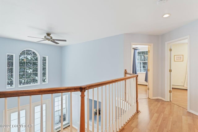 corridor with light hardwood / wood-style flooring