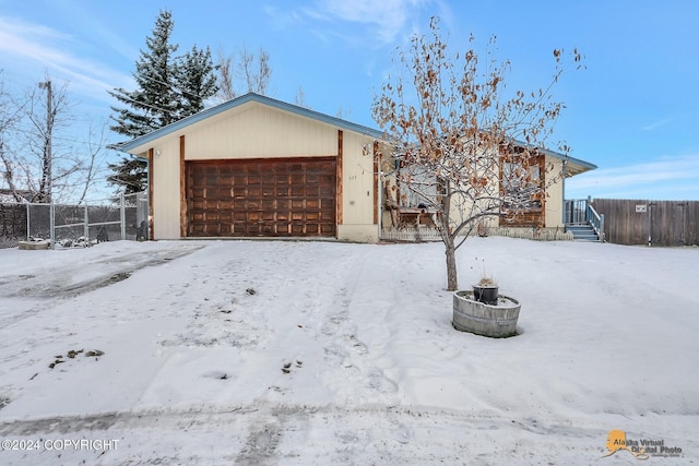 single story home with a garage