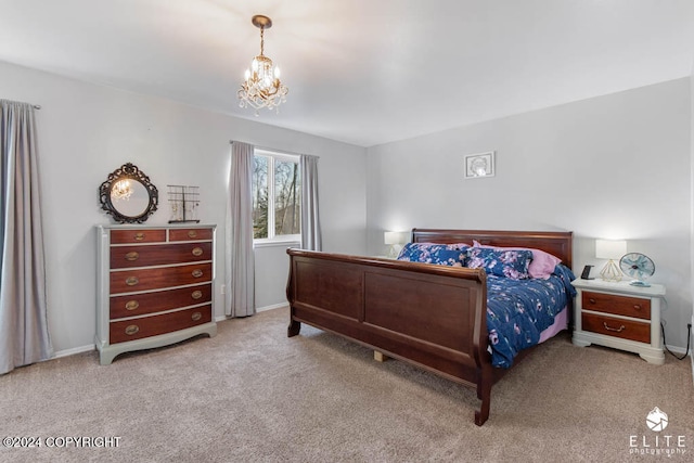 bedroom featuring light carpet and a notable chandelier