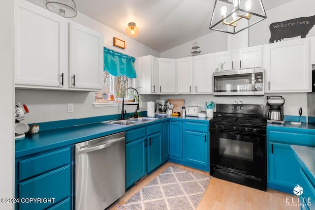 kitchen featuring sink, appliances with stainless steel finishes, lofted ceiling, blue cabinets, and light wood-type flooring