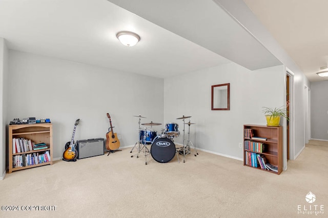 game room featuring light carpet