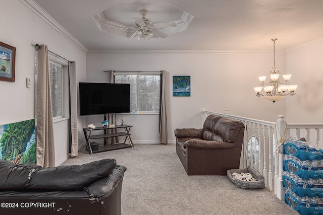 living room with a healthy amount of sunlight, crown molding, and carpet