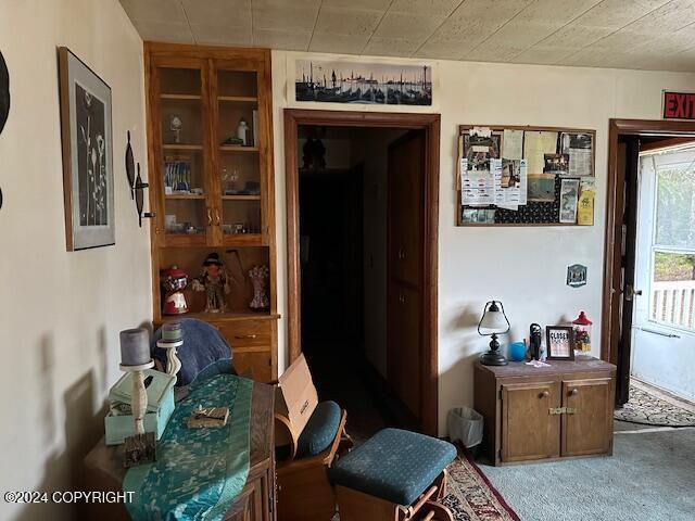 dining room featuring light carpet