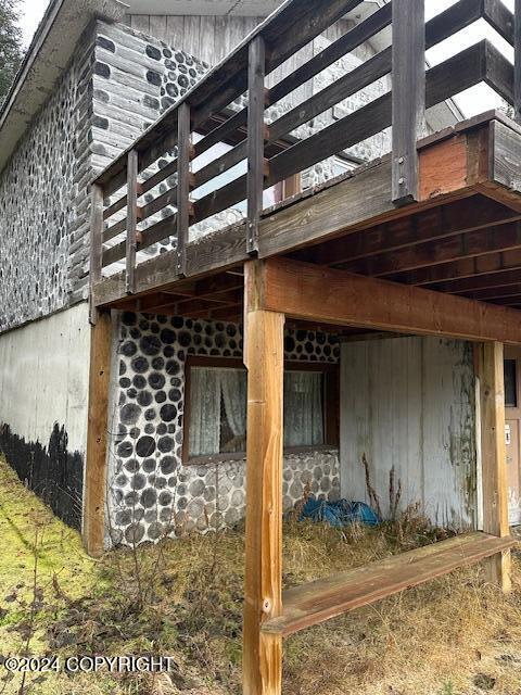 view of side of property with a deck