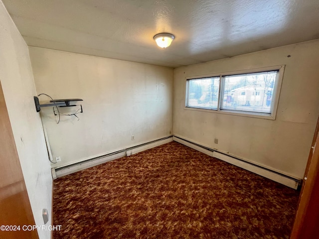 carpeted spare room with a textured ceiling