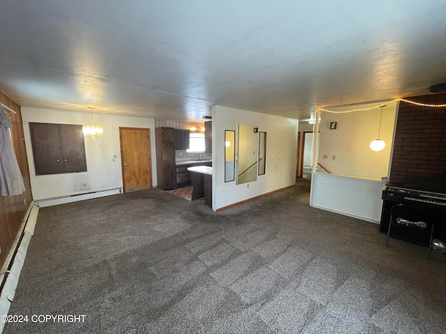 unfurnished living room featuring dark carpet and a baseboard heating unit