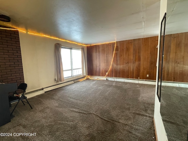 empty room featuring wooden walls and carpet floors