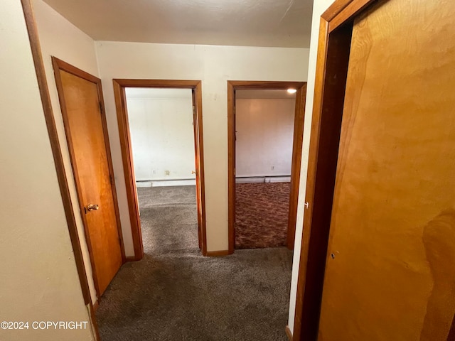 hall featuring carpet flooring and a baseboard heating unit