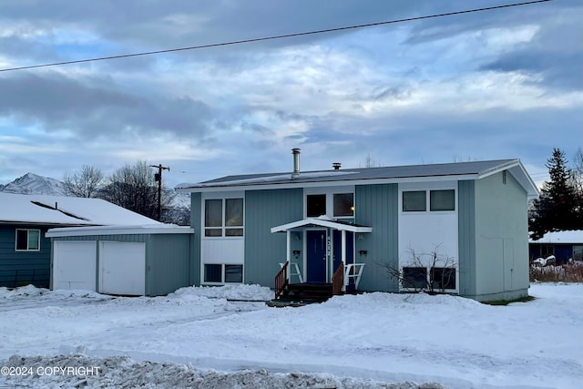 view of front of house featuring a shed