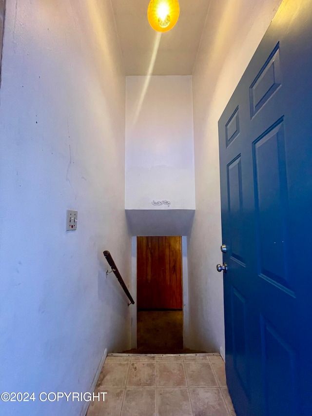 foyer entrance featuring light tile patterned flooring