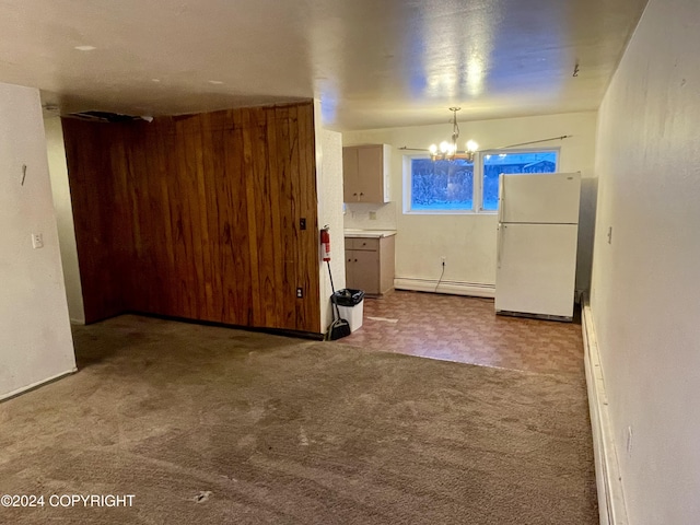 4312 E 6th Ave, Anchorage, AK 99508 - kitchen with freestanding refrigerator, a baseboard radiator, a chandelier, carpet flooring, and hanging light fixtures
