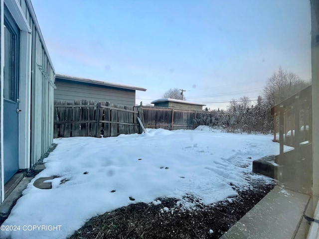 view of yard covered in snow