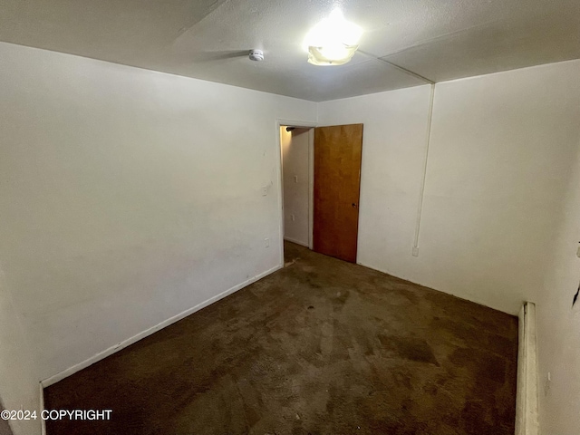 4312 E 6th Ave, Anchorage, AK 99508 - unfurnished room with carpet flooring and a smoke detector