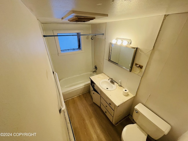 4312 E 6th Ave, Anchorage, AK 99508 - bathroom featuring toilet, wood finished floors, vanity, and bathing tub / shower combination